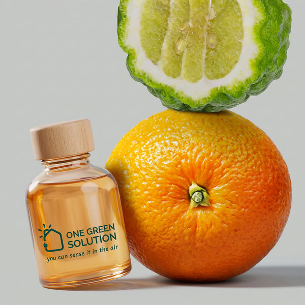 Happy Days Signature Scent oil bottle leaning on an orange with a sliced bergamot on top