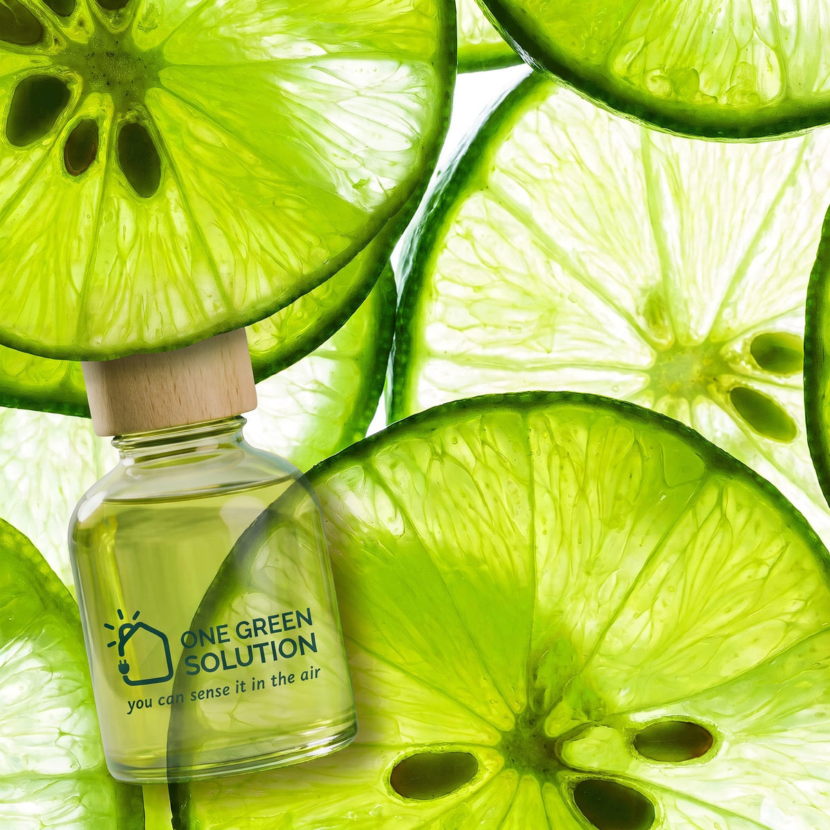 Inspiration Signature Scent oil bottle surrounded by bright, backlit lime slices