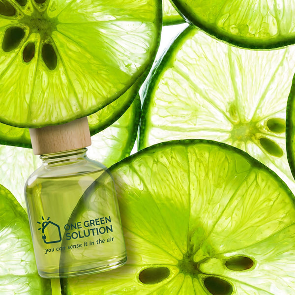 Inspiration Signature Scent oil bottle surrounded by bright, backlit lime slices