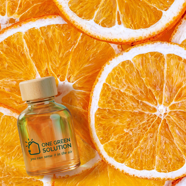 Sunny Citrus Signature Scent oil bottle on a bed of fresh orange slices
